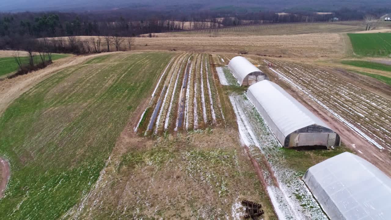 Aerial View of Greenhouses in a Winter Field