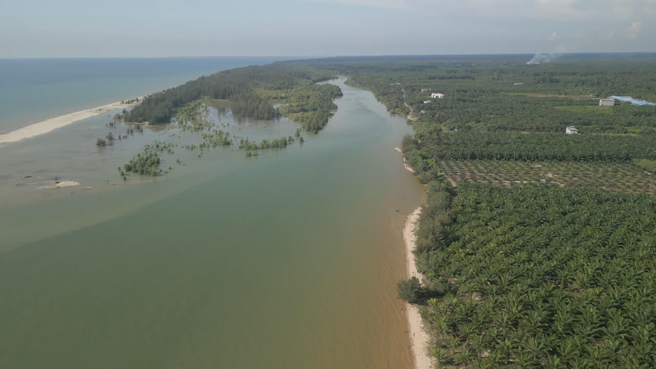 Aerial Drone View During Summer Alit Fishing Village,Kabong With, Facing Open Blue Sea, White Sandy Beach,Green Coconut, Palm Trees,And River,Sarawak,Borneo
