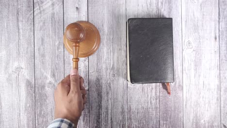 gavel and bible on wooden table