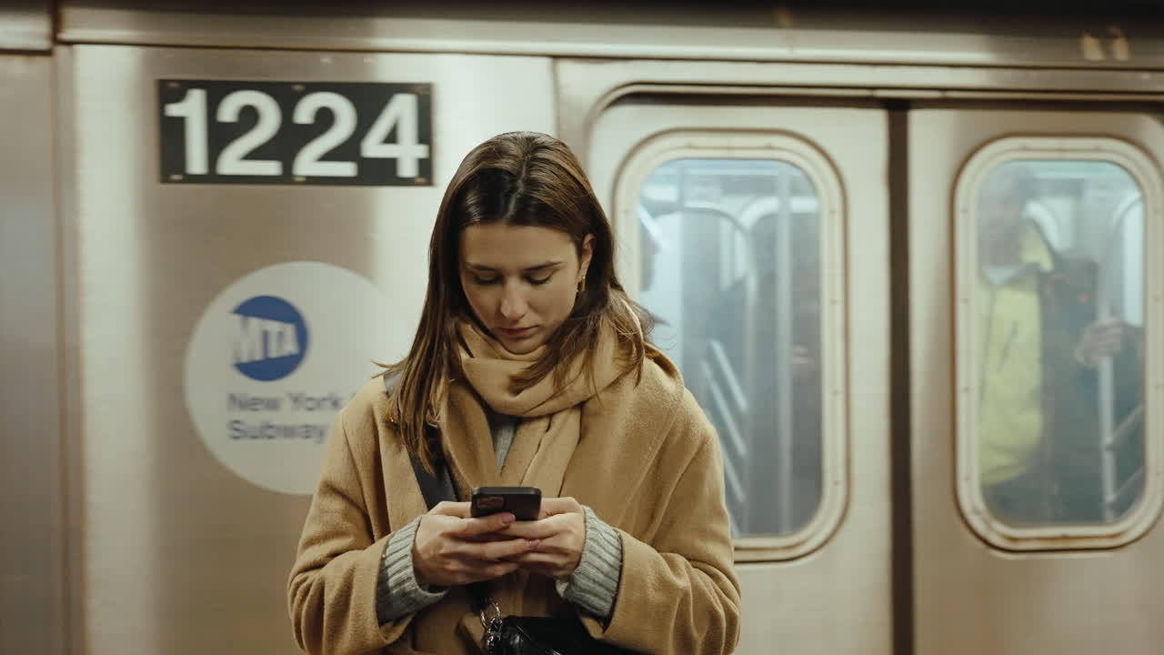 Woman on Subway Using Smartphone