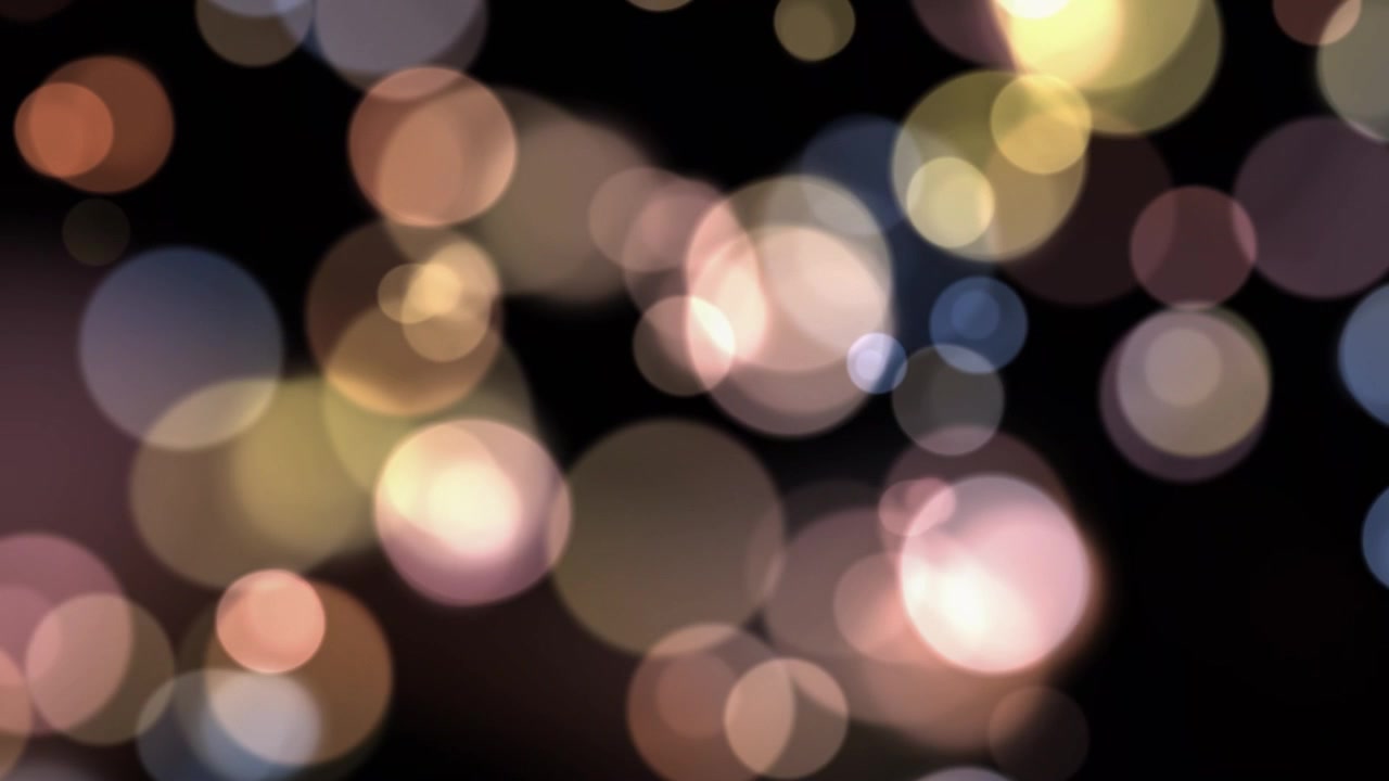 Luci Bokeh Soffuse in Movimento su Sfondo Nero