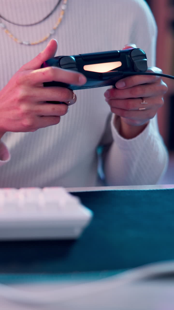 Close-up of a person playing a video game with a controller
