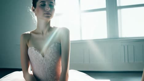 ballerina poses with eyes closed, showcasing grace and elegance in various positions under soft studio lighting