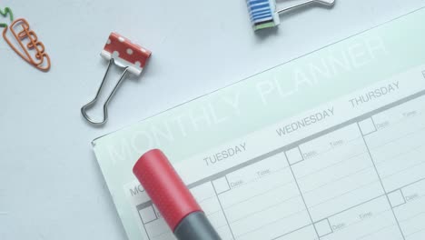 monthly planner with office supplies