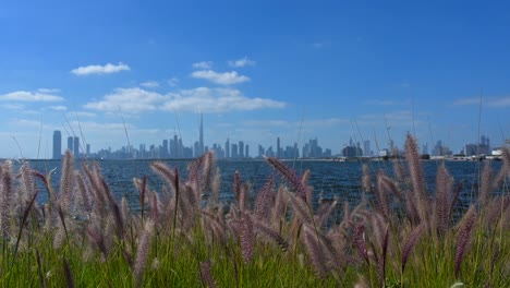 4k footage: dubai skyline from the creek harbour on a beautiful bright sunny day in the united arab emirates