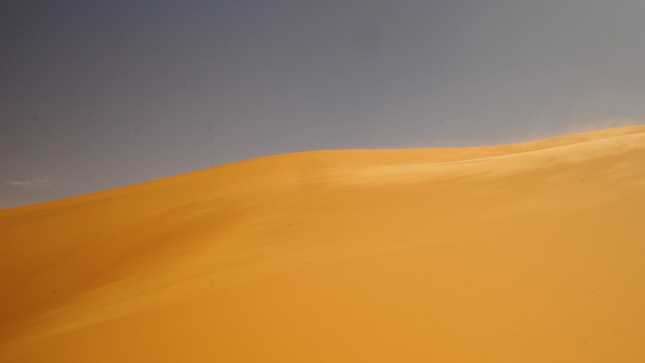 Golden Sand Dunes Of Morocco, Sahara Desert Near Merzouga In Africa. Aerial Drone Shot
