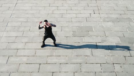contemporary hip hop street dancer hipster man with tattoo funky urban dancing freestyle in the city
