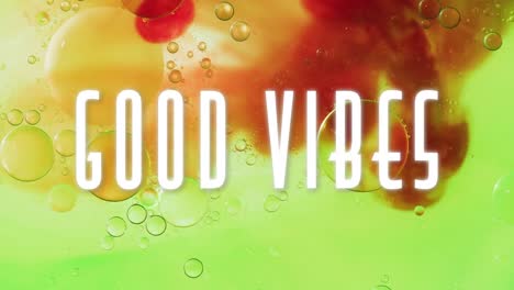 animación de buenas vibraciones texto en primer plano de líquido y bolas