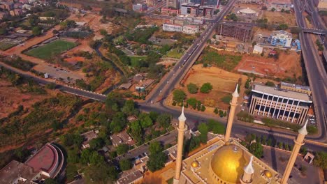 drone flying over the abuja national mosque at the edge of the nigerian capital city