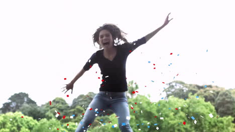 jumping and smiling woman over confetti animation in outdoor park