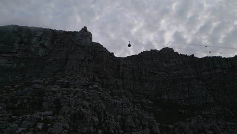 drone shot of cable car going up table mountain in cape town, south africa