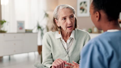 elderly woman conversing with caregiver