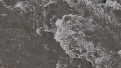 drone shot of nepal's river experiencing heavy rain and monsoon flooding