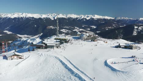aerial view of a snowy ski resort in the alps