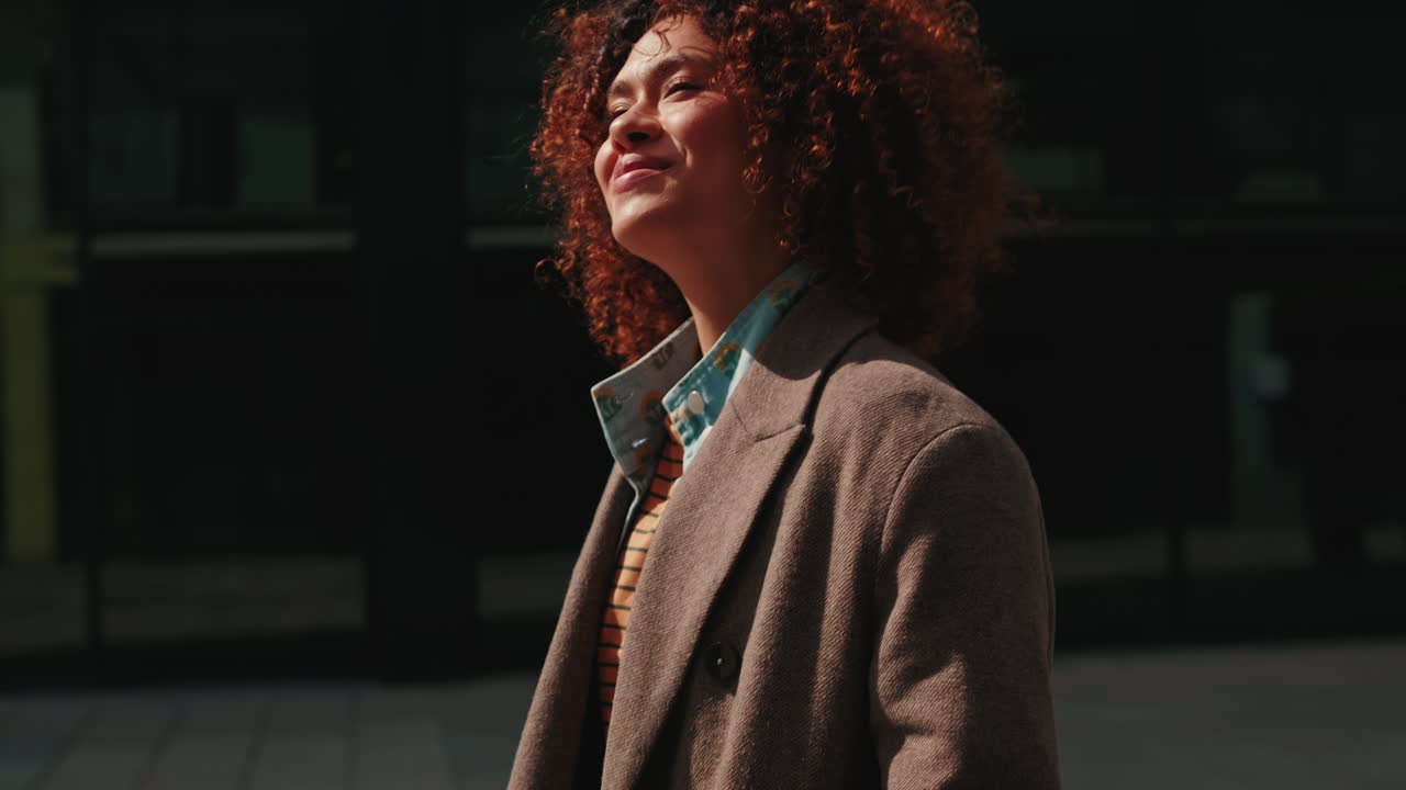 Happy Businesswoman Walking in City