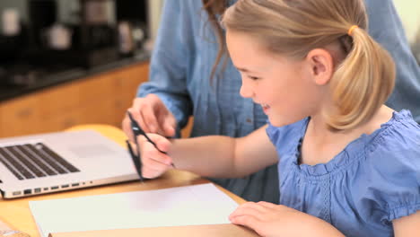 mother and daughter using a compass