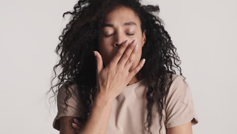 African-american-tired-woman-over-white-background.