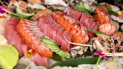 a colorful display of assorted sushi and sashimi.