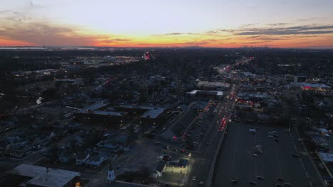 an aerial time lapse over a suburban neighborhood at sunset