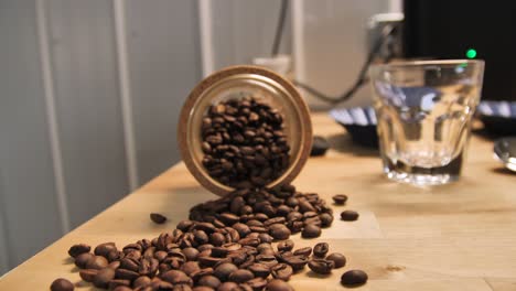 coffee beans on a table top, slow motion dolly out establishing shot