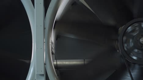 turbine fan spinning inside factory to ventilate system, close up