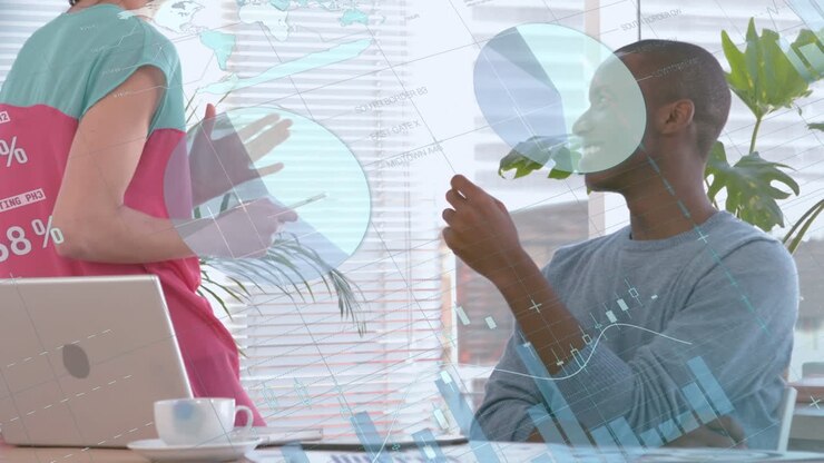 Animation of diverse data and graphs over happy diverse female and male workers in office