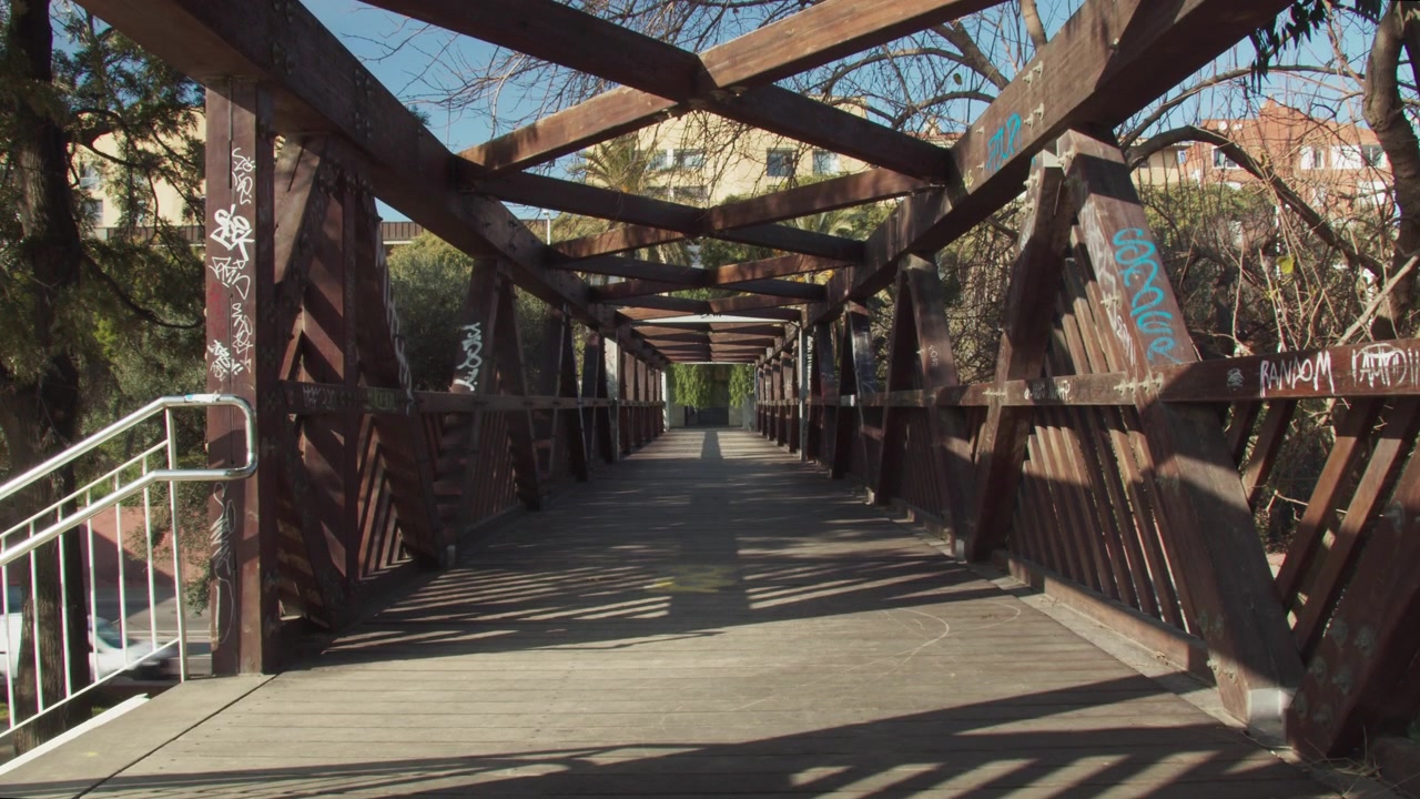 Lonely moderm wooden bridge above a highway