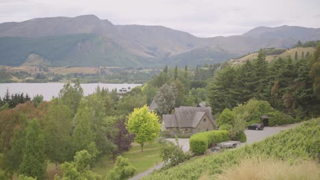 steady shot of stoneridge chapell chruch and lake hayes and the farm estate queenstown