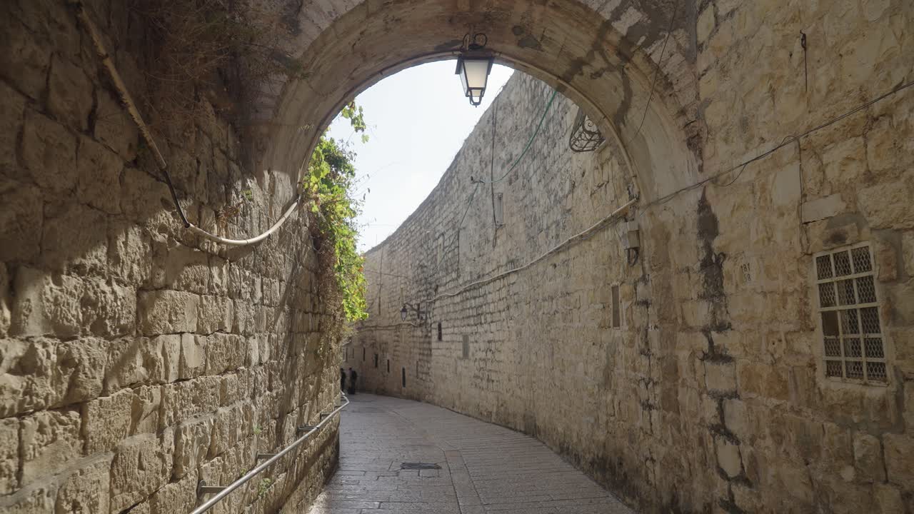 Walking Through Narrow Alley With Arch Passage Between High Stone And Brick Walls In Jerusalem - POV