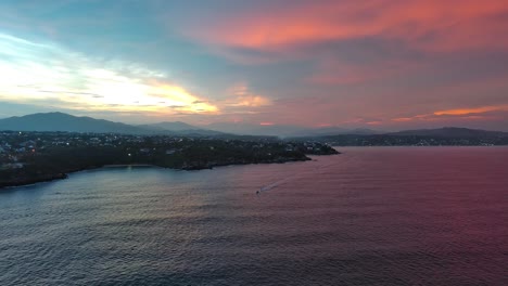 pink ocean sunrise aerial sky drone over puerto escondido mountains mexico beach