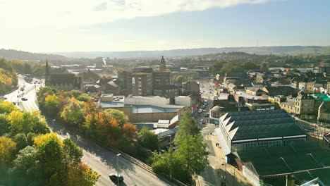 aerial footage of the large market town centre of dewsbury in west yorkshire in the uk showing the historical town centre and townhall