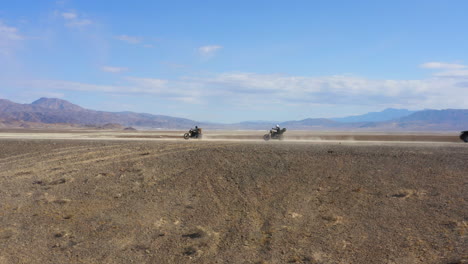 outcast badass gang of riders going through desert, side view profile with copy space