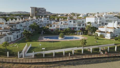 view of apartment complex moving backwards into the ocean