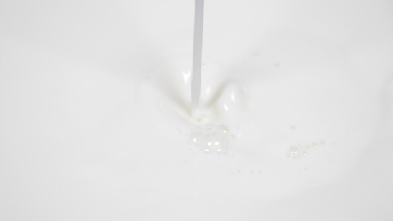 Pouring fresh milk in super slow motion 4k