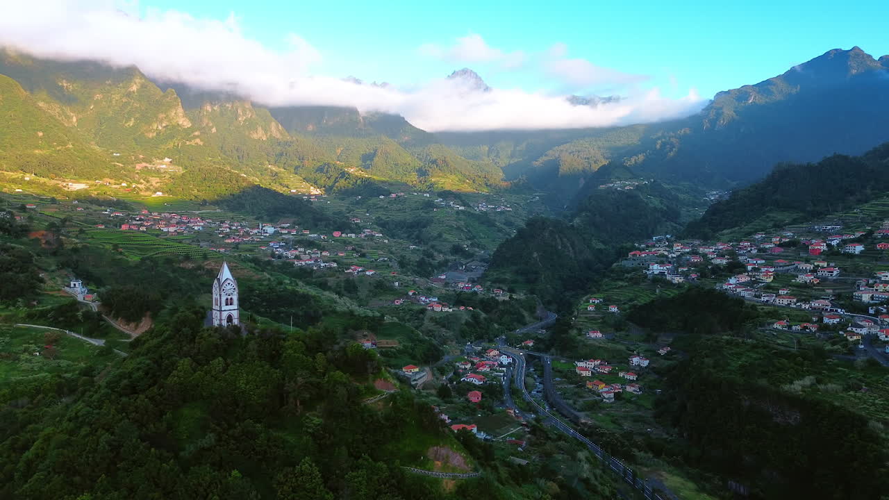 Amazing Chapel of Saint Fatima on the green mountain. Splendid view of Sao Vicente valley hiding in the mountains. The Madeira Islands, Portugal. Aerial view.