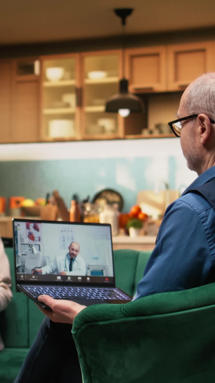 Vertical Video Elderly people participating in virtual telehealth conference with physician