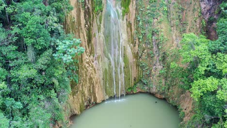 Aerial-orbit-shot-of-idyllic-waterfall-falling-in-lake-during-sunny-day---SALTO-DEL-LIMON,-SAMANA