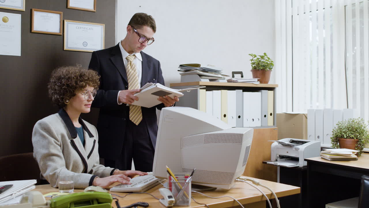 Woman using a retro computer in vintage office.
