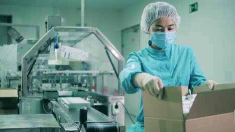 female health worker packing medicines. drugs production, pharmacist working, pharmaceutical manufacturing, pharmaceutical industry concept.