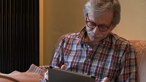 senior man with gray hair relaxing at home