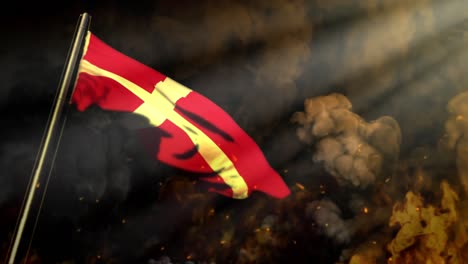 waving denmark flag on smoke and fire with sun beams - cataclysm concept