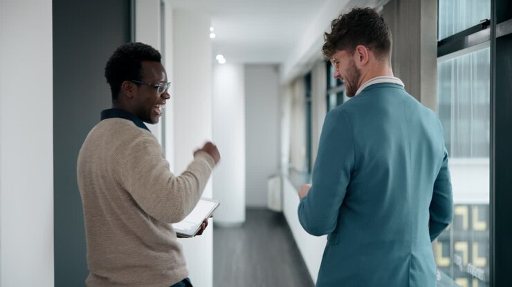 Two Businessmen Collaborating in a Modern Office