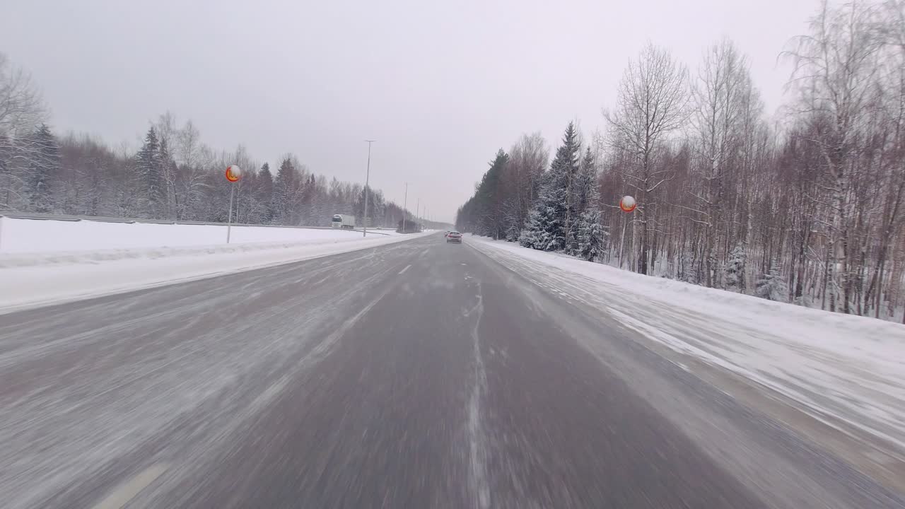Winter conditions on the highway don't hinder the car, which expertly speeds through snowy terrain