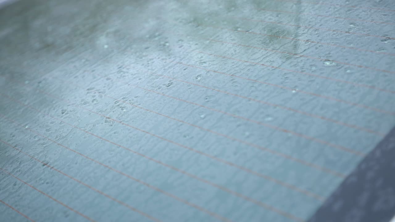 Car Windshield With Rain Drops On A Rainy Day. - close up shot