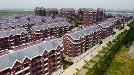 Aerial-view-over-a-residential-complex-in-cloudy-Nanhai-New-District,-China
