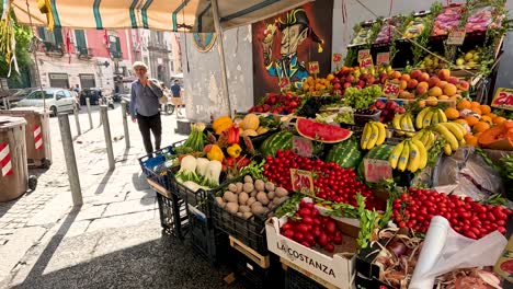 man shopping at a vibrant vegetable stall