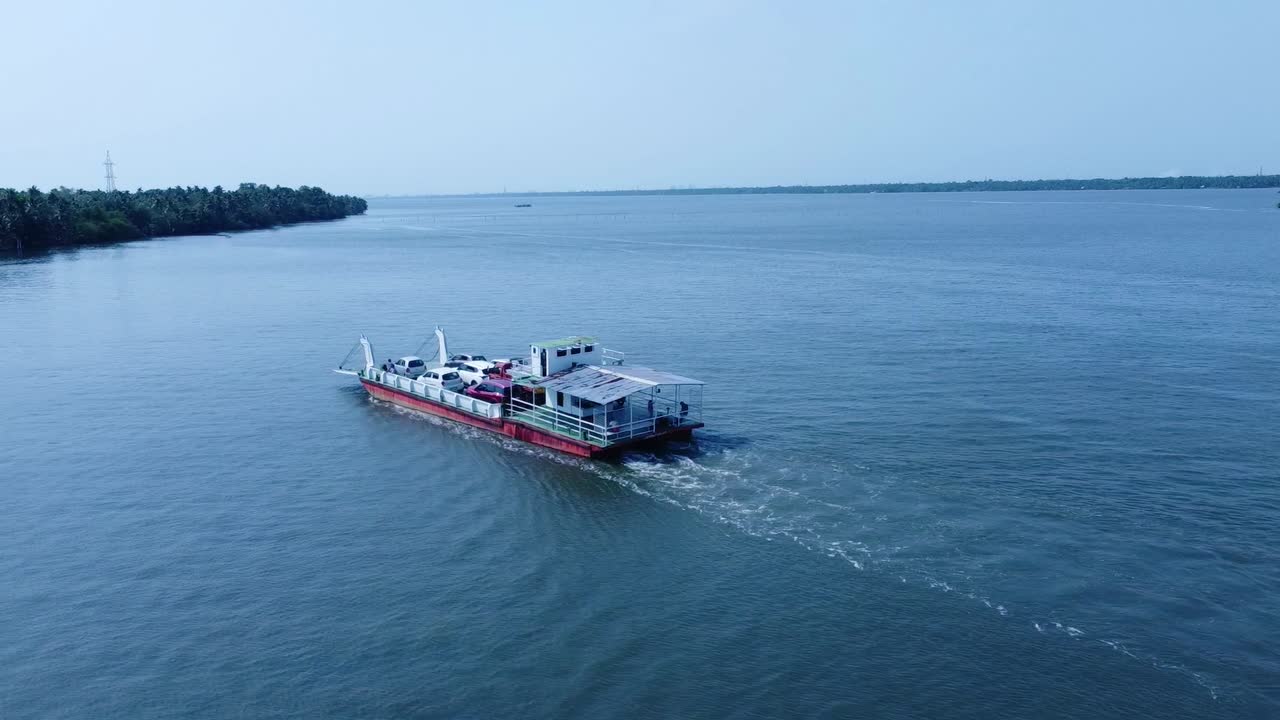 A Jankar service that transports small vehicles to the boat jetty of a beautiful island. Perumbalam island lake transportation in Kerala, India