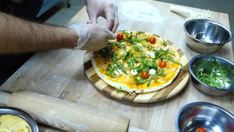 cooking pizza - spreading tomatoes