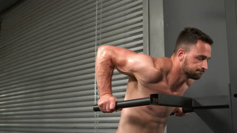 fit man doing pull up exercise