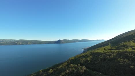 experience the tranquility of morning over stunning coastlines, lush greenery, and calm waters